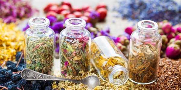 Bottles of healing herbs, herbal medicine.